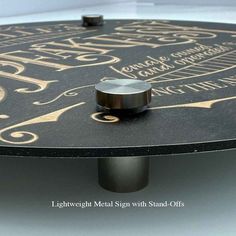 a black table with gold lettering on it