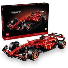 a red lego ferrari racing car in front of a box with it's wheels