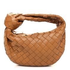 This is an authentic BOTTEGA VENETA Nappa Intrecciato Mini Jodie in Caramel. This stylish shoulder bag is beautifully crafted of soft woven lambskin leather in brown. The shoulder bag features a matching handle and a gold top zipper that opens to a compact brown leather interior. Mini Jodie, Triangle Bag, Bottega Veneta Bags, Stylish Shoulder Bag, Gold Top, Leather Interior, Lambskin Leather, Bottega Veneta