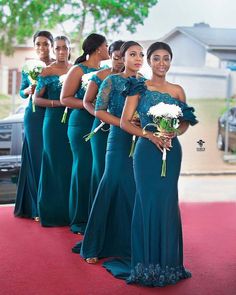 the bridesmaids are all wearing green dresses