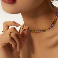 Introducing our exquisite 18k Gold Plated Non-Tarnish Multicolor Necklace, the epitome of modern sophistication and cool elegance. Crafted with meticulous attention to detail, this necklace features a stunning array of vibrant zirconia stones in a rainbow of colors, set against a backdrop of luxurious 18k gold plating. This chic choker necklace is designed to add a pop of color and a touch of whimsy to any outfit, whether you're dressing up for a night out or adding flair to your everyday look. Colorful Choker, Multicolor Necklace, Bridesmaid Gifts Jewelry, Rainbow Necklace, Unisex Necklace, Tennis Necklace, Modern Necklaces, Bridesmaids Gifts, Necklace Chain