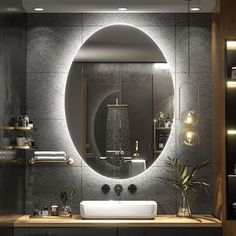 a bathroom with a round mirror above the sink