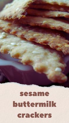 some crackers are stacked on top of each other with the words sesame buttermilk crackers