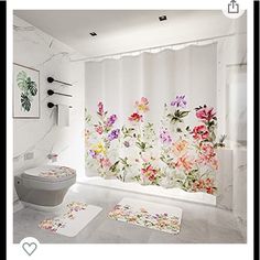 a bathroom with floral shower curtain and rugs on the floor next to the toilet