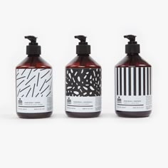 three different types of hand soaps on a white background with black and white designs