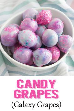 candy grapes in a bowl with pink and blue sprinkles on top, text overlay says candy grapes galaxy grapes