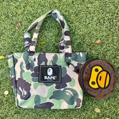 A Bathing Ape Bape Baby Milo Tote Bag Brand New, No Tag, Never Worn Seal In Package Original From Japan 100% Authentic Bape X Japanese Magazine Collaboration Product 1). Tote Size: 8” (W) X 11” (H) X 6” (D) With Strap: 14” (H) 2). Baby Milo Bag : 6” Radius. Can Turn Into Another Recycle Bag Material: Polyester Ship Within 24 Hours Final Sale Bape Kids, Reuseable Bag, Baby Milo, Japanese Magazine, Ape Bape, Camo Backpack, Money Stacks, Handbag Essentials, Recycle Bag