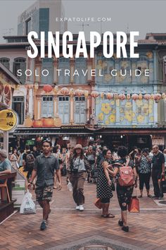 people are walking around in front of an old building with the words singapore solo travel guide