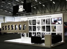 an exhibit booth with black and white photos on it