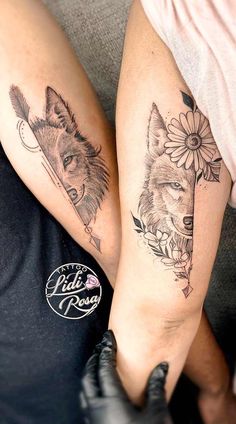 two people with tattoos on their legs and one has a wolf tattoo on the arm