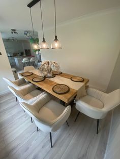 a dining room table with six chairs around it