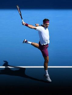 a male tennis player in action on the court