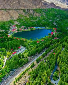 an aerial view of shanri - la resort with trees and mountains in the background