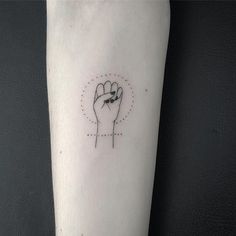 a small tattoo on the arm of a person