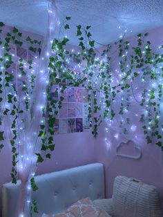 the bedroom is decorated with vines and lights