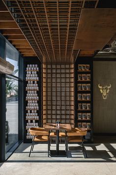 a dining room with wooden tables and pictures on the wall