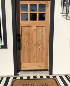 a welcome mat is placed in front of a door