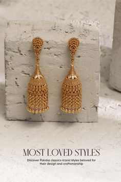 The intricate floral design and elongated cylindrical shape come together in perfect harmony, showcasing artisanal mastery. Crafted from 925 silver, these jhumkas exude elegance with a contemporary twist. Don't miss our exciting offer – enjoy a remarkable 10% discount using code BEST10. Luxury Yellow Gold Jhumkas For Wedding, Indian Gold Earrings Teardrop, Gold Jhumka Earrings Temple Jewelry, Luxury Gold Plated Jhumkas For Festivals, Luxury Gold Plated Round Jhumkas, Luxury Gold Round Jhumkas, Traditional Luxury Yellow Gold Jhumkas, Luxury Gold Jhumkas For Reception, Luxury Elegant Chandbalis For Ceremonial Occasions