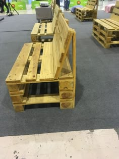 several wooden benches made out of pallets on display