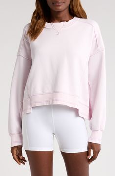 A boxy fit lends relaxed energy to this slightly cropped cotton-blend sweatshirt. 21 1/2" length (size Medium) Crewneck Long sleeves 80% cotton, 20% polyester Machine wash, tumble dry By Free People; imported Sporty Drop Shoulder Spring Sweatshirt, Spring Sporty Drop Shoulder Sweatshirt, Sporty Drop Shoulder Sweatshirt For Spring, Pink Drop Shoulder Sweatshirt With Ribbed Cuffs, Spring Athleisure Sweatshirt With Boxy Fit, Spring Athleisure Boxy Fit Sweatshirt, Pink Crew Neck Activewear For Fall, Sporty French Terry Tops For Spring, Sporty French Terry Sweats