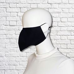 Bird beak face mask is made from two layers of 100% cotton fabric with elastic straps for behind the ears. Outer fabric is solid black. Elastic straps include silicone adjusters for perfecting your fit. Removable nose wire included. (Note: no filter pocket.) Inner fabric may vary. Mask is lightweight and washable. Tip of mask measures approximately 3 inches from face when worn. Inside is open with no filling to impede your breathing. Since the mask is completely open inside, inserting a tissue o Beak Mask, Cool Face Masks, Peacock Costume, Bird Beaks, Bird Masks, Last Minute Halloween Costumes, Mask Black, Face Mask Black, No Filter