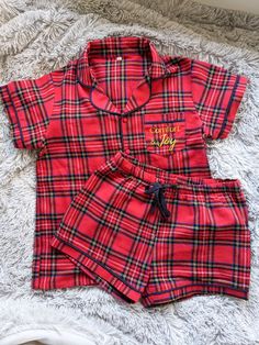 Nothing says Christmas quite like this red tartan print, perfect for festive family pyjamas. Our 'Comfort and Joy' Christmas pyjama range is made from 100% brushed cotton, making them cool and soft for the whole family. Men's, children's and baby's versions available so the whole family can match.  *100% brushed cotton *Button up, two-piece set *Navy blue trim *Comfort and joy embroidered pocket *Matching family sets available Christmas Pajamas Set, Matching Xmas Pajamas, Cute Womens Christmas Pajamas, Plaid Cotton Sleepover Sets, Plaid Cotton Sets For Sleepover, Plaid Cotton Sleep Sets, Christmas Pjs Aesthetic Family, Plaid Cotton Sleepwear Sets, Red Cotton Holiday Sleepwear