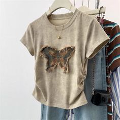 🔍 “Tie-dye butterfly short-sleeved” Add a pop of color to your summer wardrobe with our tie-dye butterfly short-sleeved top. Made from 100% cotton, this top features a slim waist fit and cropped design, perfect for keeping you cool and stylish during the warm weather. Embrace the beauty of nature with our unique butterfly design. #ladiestops #fashion #tops #ladiestop #ladieswear #onlineshopping #womentops #womentop #ladiesfashion #discount #womentopwear #womenwear #ladieskurtis #womenfashio... Butterfly Inspired Outfit, Korean Crop Top, Y2k Shirts, Butterfly Patch, Crop Top Summer, Patch Top, Unique Butterfly, Butterfly Shirt, Slim Fit Crop Top