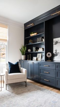 a living room filled with furniture and bookshelves on top of a wooden floor