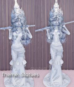 two statues of a woman holding a stick and wearing blue hair are shown side by side