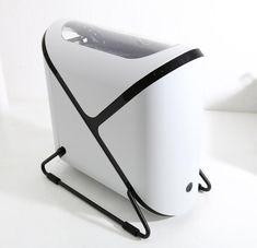 a white and black computer case sitting on top of a table