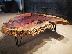 a table made out of wood and metal legs