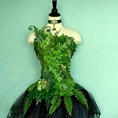 a dress made out of plants on a mannequin