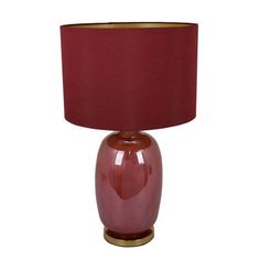 a red table lamp with a gold base and a maroon shade on the bottom half