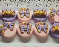 there are many cupcakes with butterflies on them