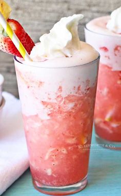 two glasses filled with ice cream and strawberries