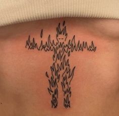 a person with a tattoo on their back that has flames coming out of the chest