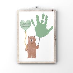 a bear holding a green hand print with the words i love you, one heart