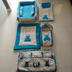 four pieces of baby bedding laid out on the floor