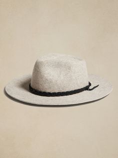 Handcrafted from 200-gram Argentine wool felt, this Hampui hat conjures up memories of markets in Marrakesh with it's braided leather trim.  HAMPUI: Rugged, yet always-refined, adventuresome Hampui hats are handcrafted from beautiful, sustainable materials that showcase the magic of the natural world.  Brim Width: 3. 25" Crown Height: 5" Small: 21. 7" (55cm) Medium: 22. 4" (57cm) Large: 23. 2" (59cm) X-Large: 24" (61cm)