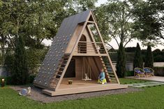 a child's play area with a climbing wall and wooden ladders on the roof