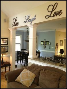 a living room filled with furniture and decor