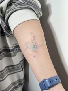 a person with a tattoo on their arm