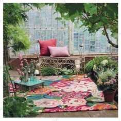 an outdoor area with potted plants and a bench