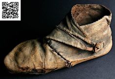 an old pair of shoes that have been covered in wax and dirt with a qr code on it