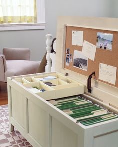 an open drawer with several files in it