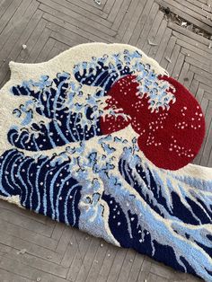 a rug with an image of the great wave on it