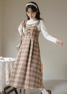 Tweed plaid pinafore dress with flutter straps, little bows down the chest and a midi skirt. Concealed back zipper. S: 33" chest, 26.5" waist, 42" lengthM: 34.5" chest, 28" waist, 42" lengthL: 36" chest, 29.5" waist, 42.5" lengthXL: 37.5" chest, 31" waist, 42.5" length Casual Brown Pinafore Dress For Fall, Brown Plaid Dress, Plaid Outfits, Church Outfits, Pinafore Dress, Brown Plaid, Brown Dress, Overall Dress, Dress With Cardigan