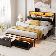 a bedroom with a bed, nightstands and lamps on the side of the room