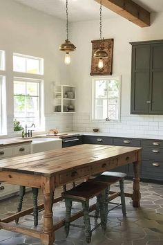 a large wooden table sitting in the middle of a kitchen