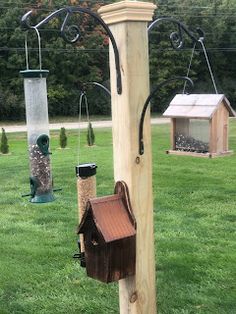 a wooden pole with bird houses on it